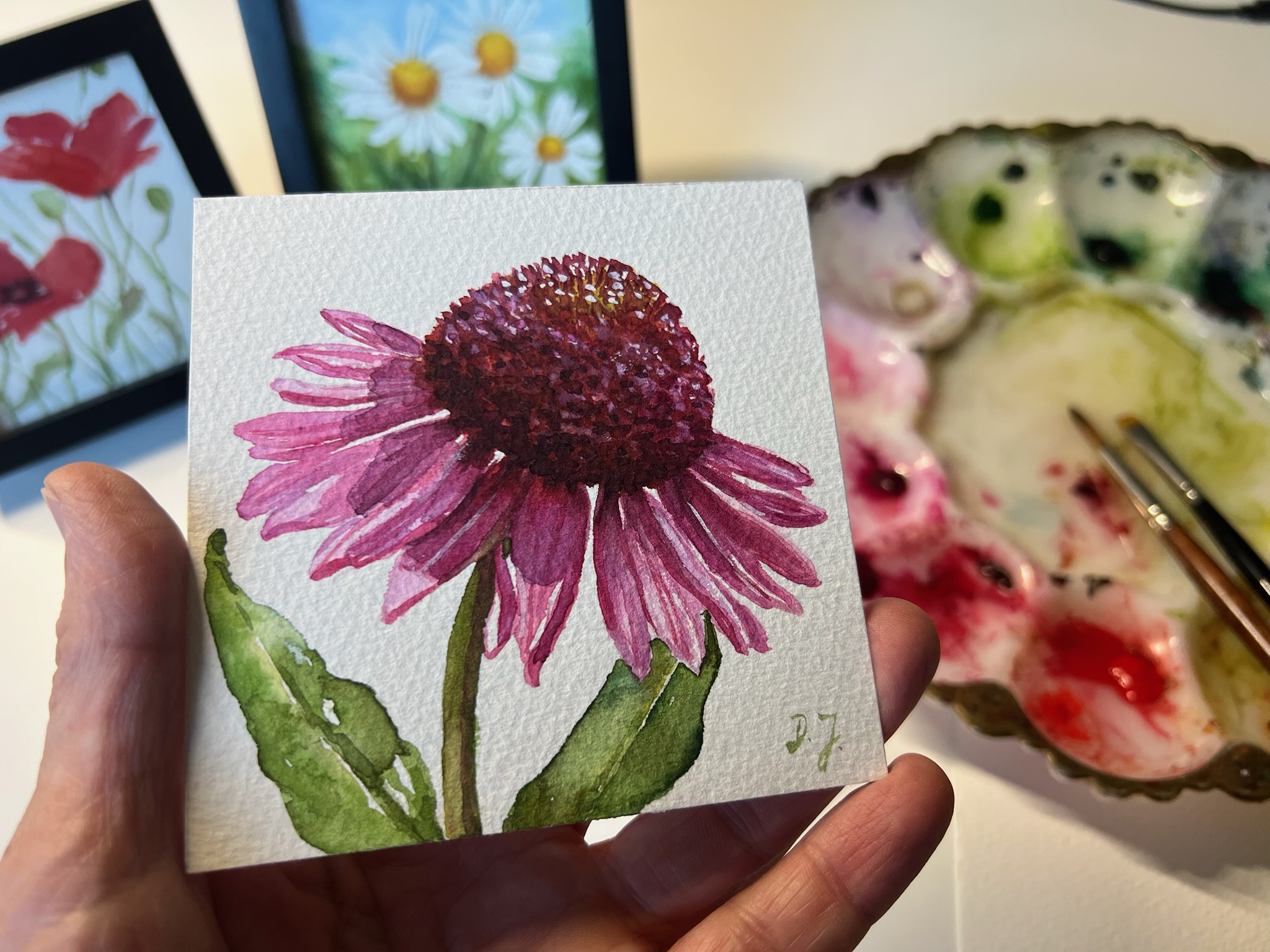 Little Floral Poem in the hand of artist Doris Joa